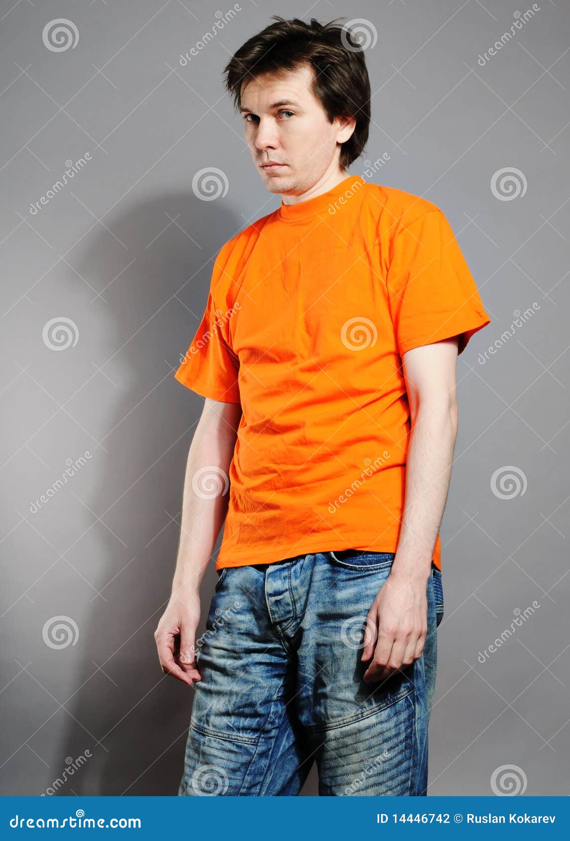 Man in orange shirt. stock photo. Image of european, unshaven 14446742