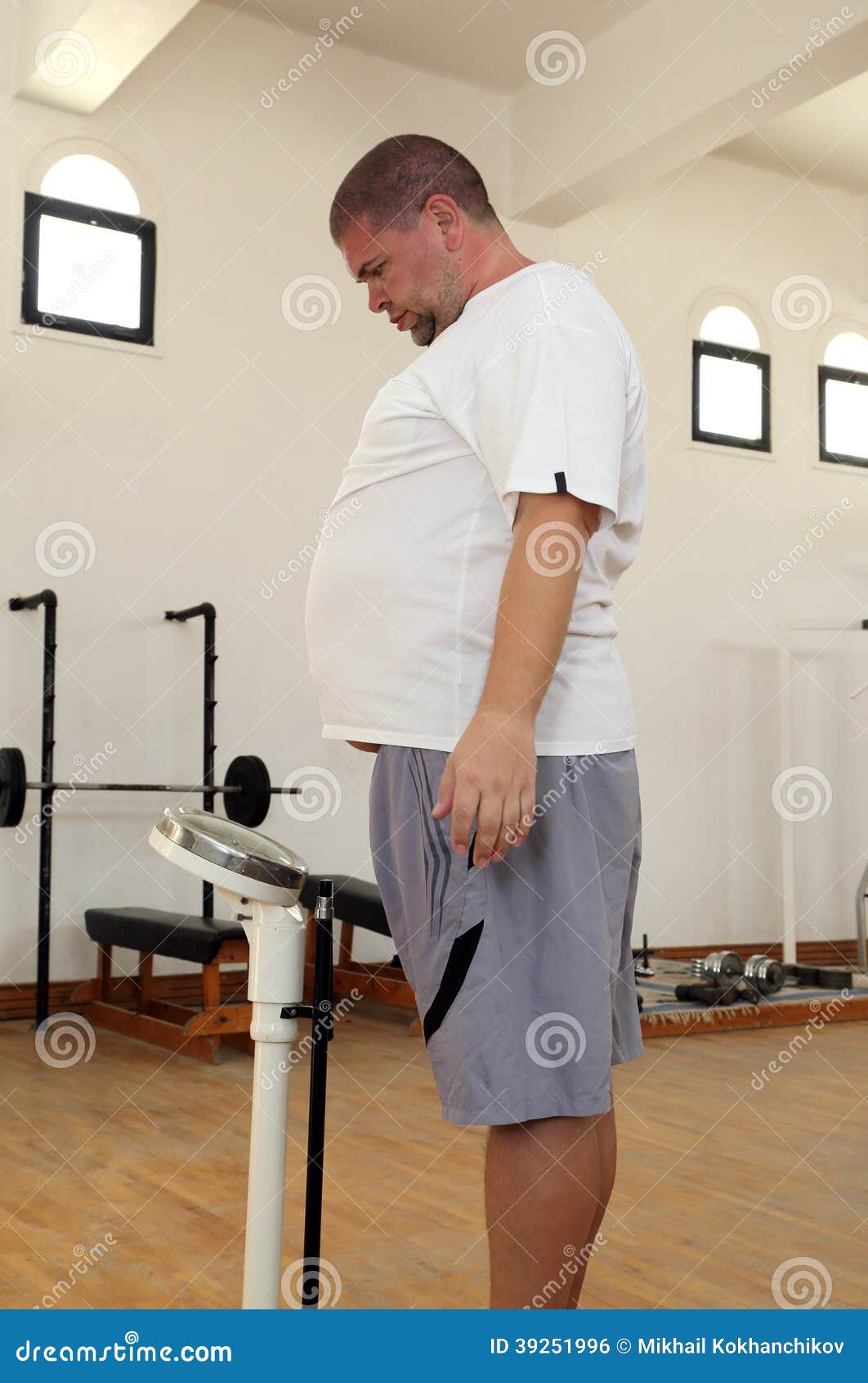 Man with Overweight on Scales in Gym Stock Photo Image of build, male