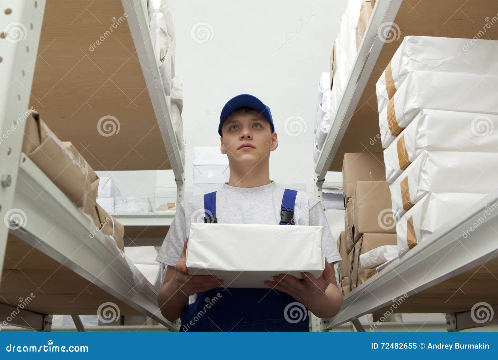 Man with Package in Uniform at Warehouse Stock Image Image of male