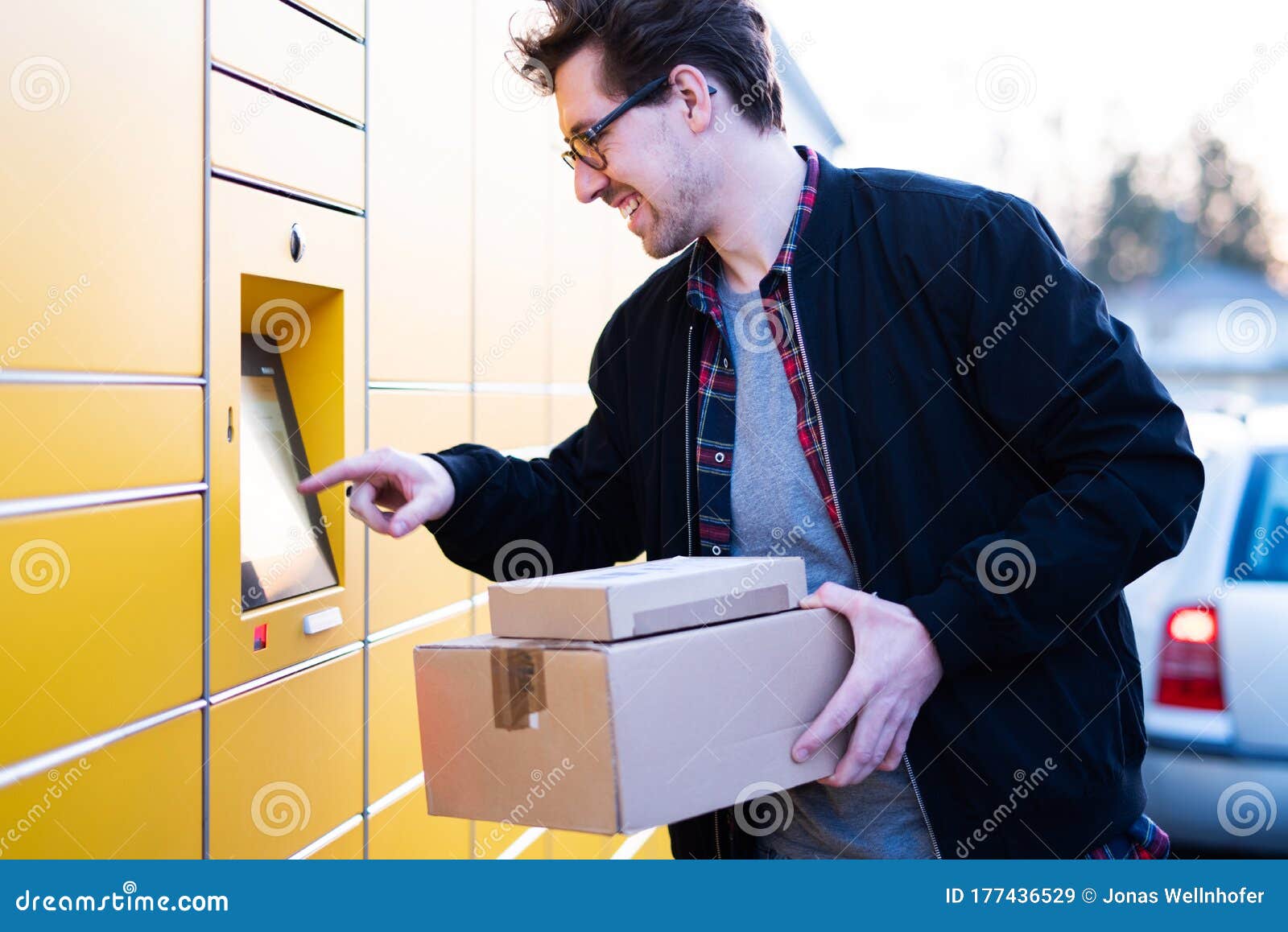 A Man at a Packing Station, Collecting and Sending Parcels Stock Image