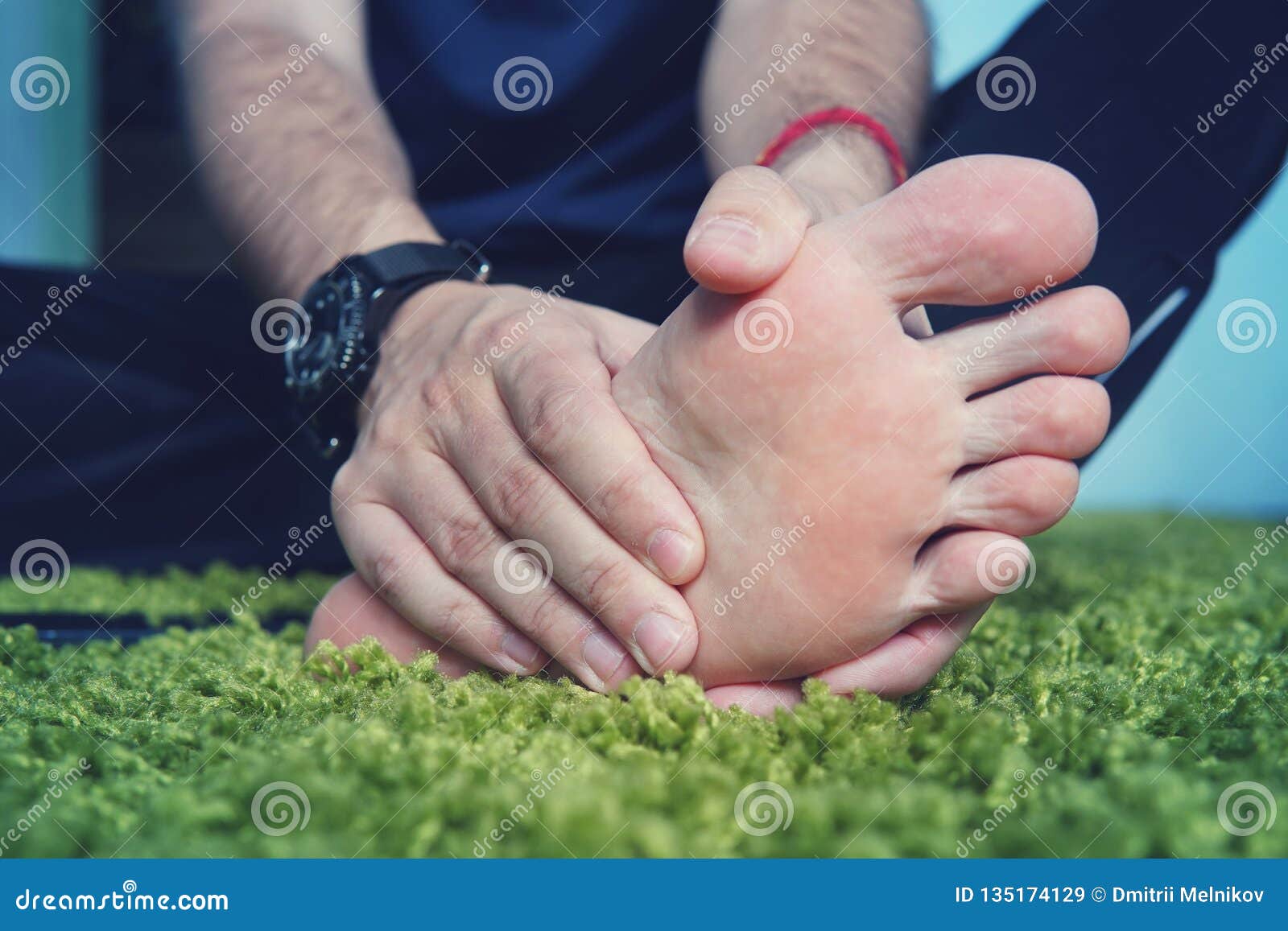 man with painful and inflamed gout on his foot around the big toe area