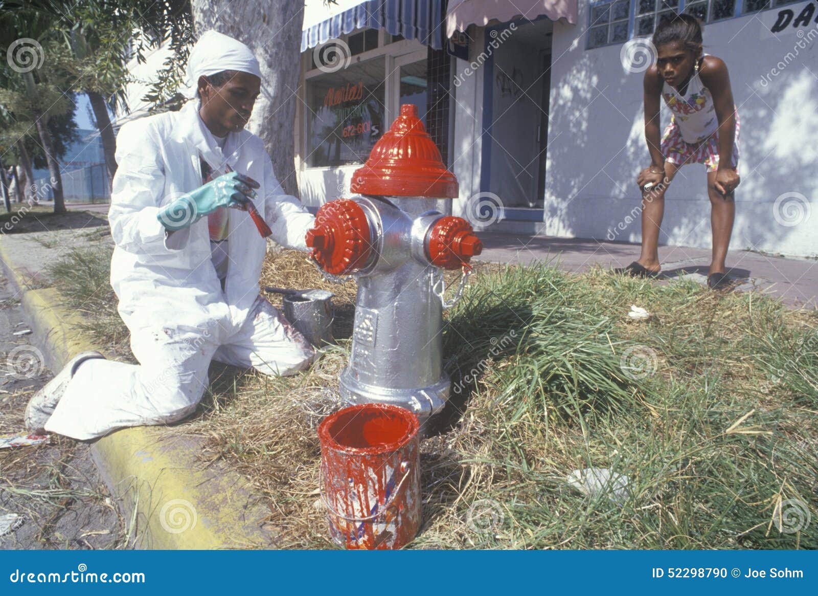 Man Painting a Fire Hydrant, South Beach, Florida Editorial Image