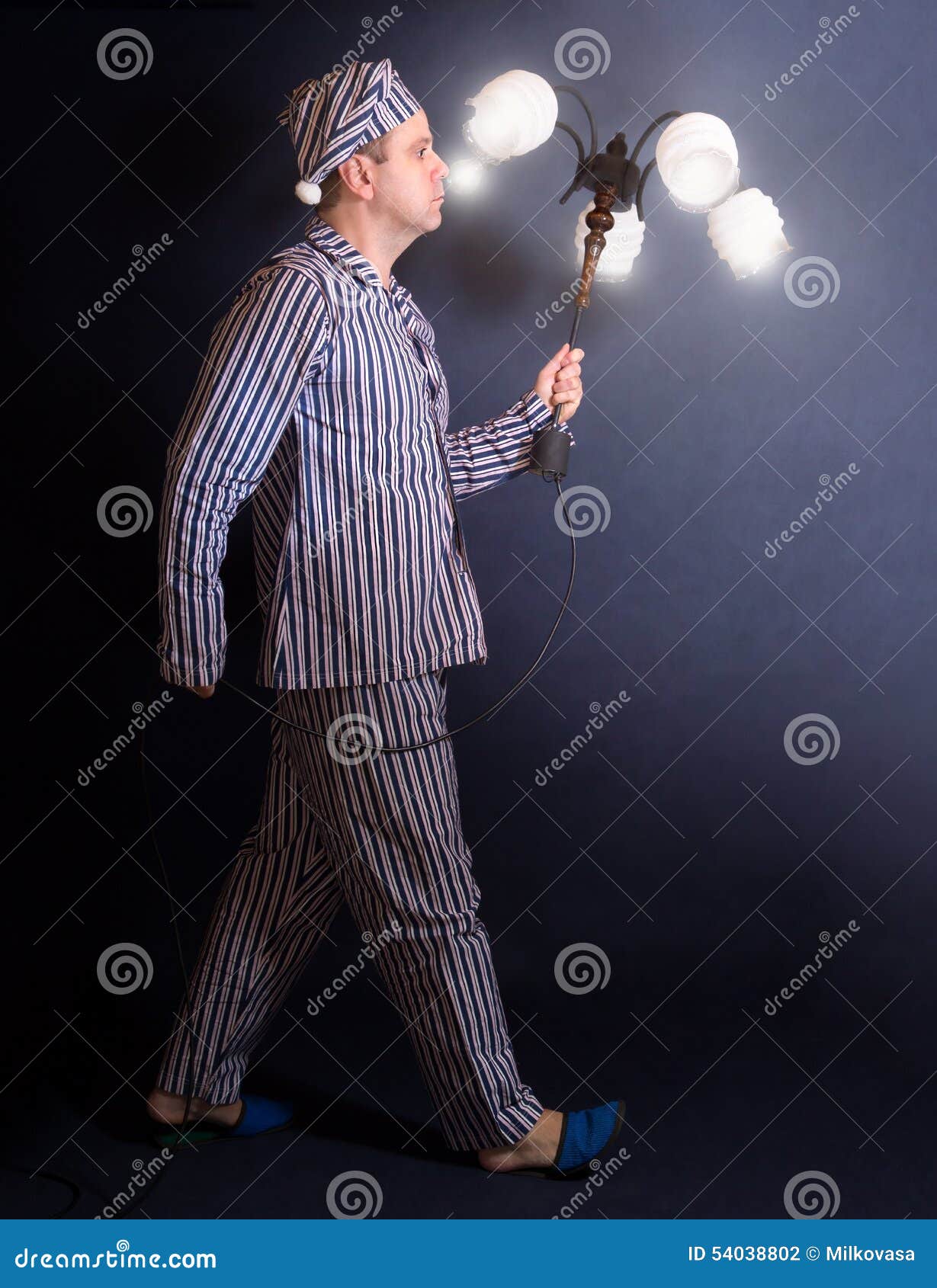 Man in Pajamas Carries Chandelier Stock Photo - Image of male, alone ...