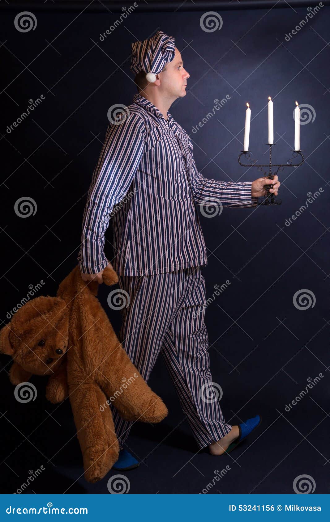 Man In Pajamas Goes Sleep Stock Photo - Image: 53241156