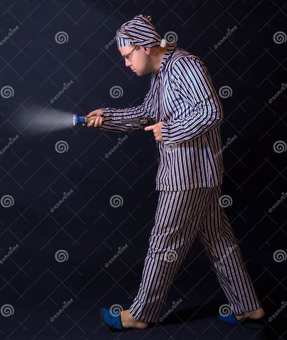 Man in Pajamas Walking with a Gun Stock Photo - Image of pajamas ...