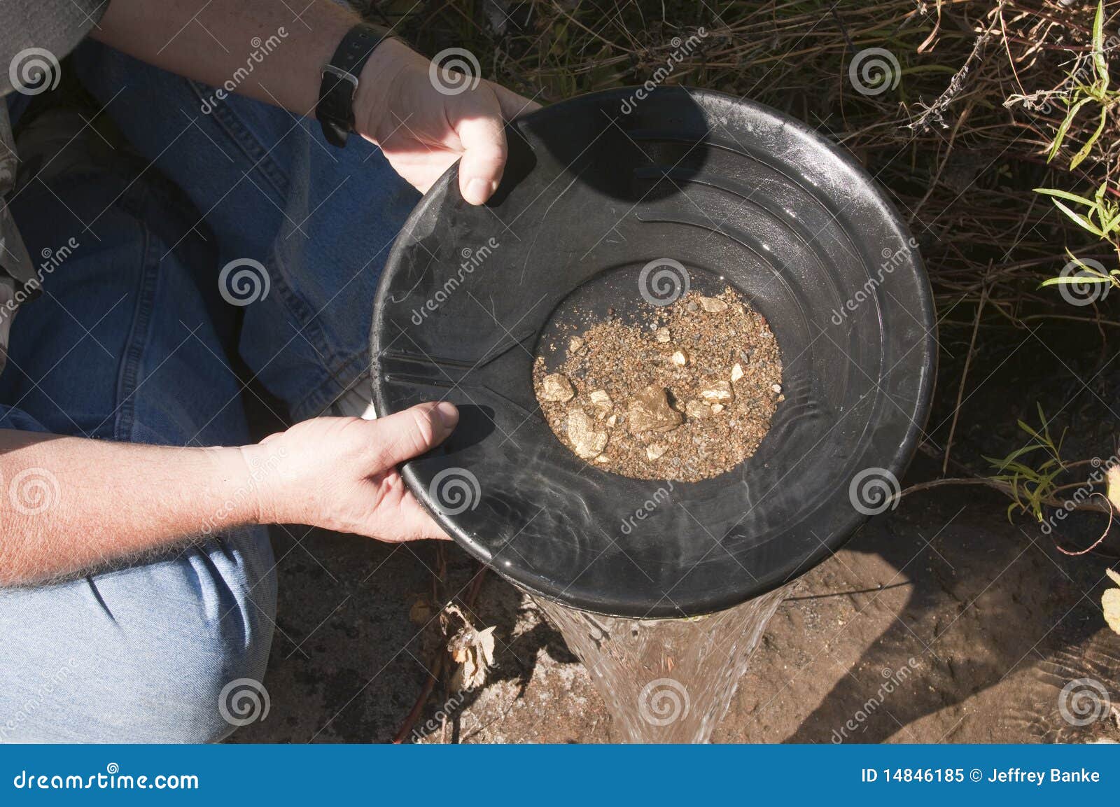 man panning for gold