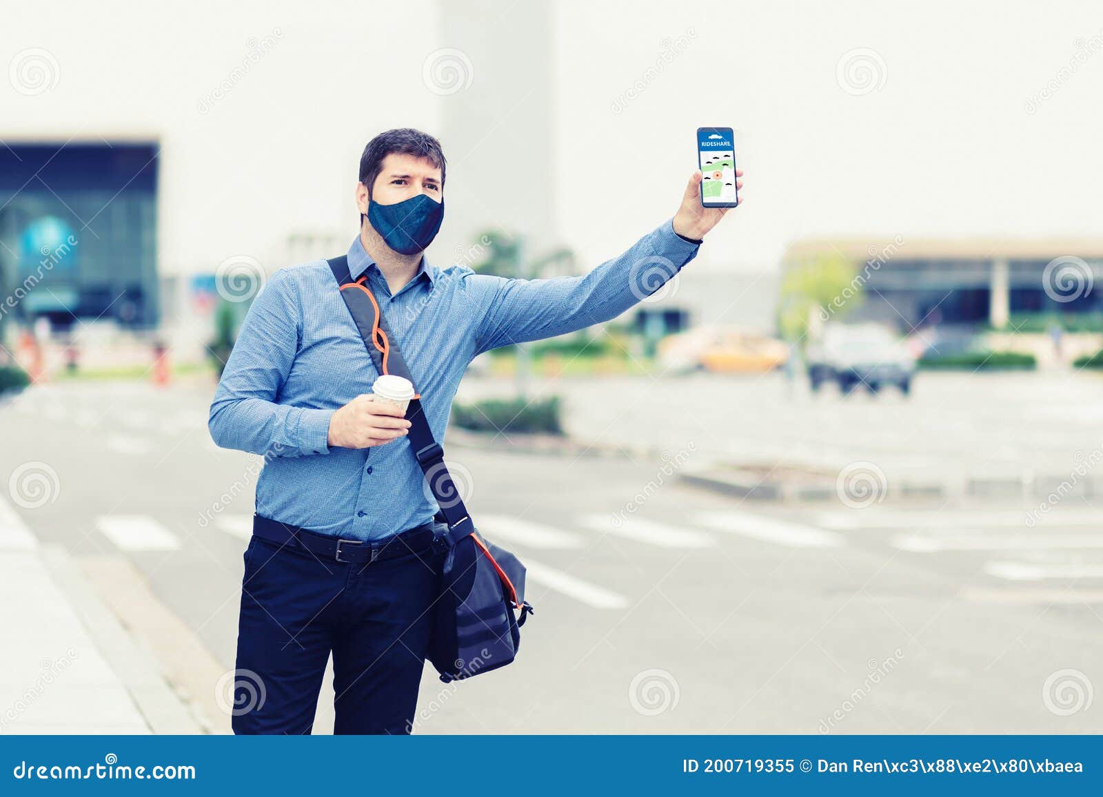 Man Passenger with Protective Face Mask Using Mobile Taxi App Waiting