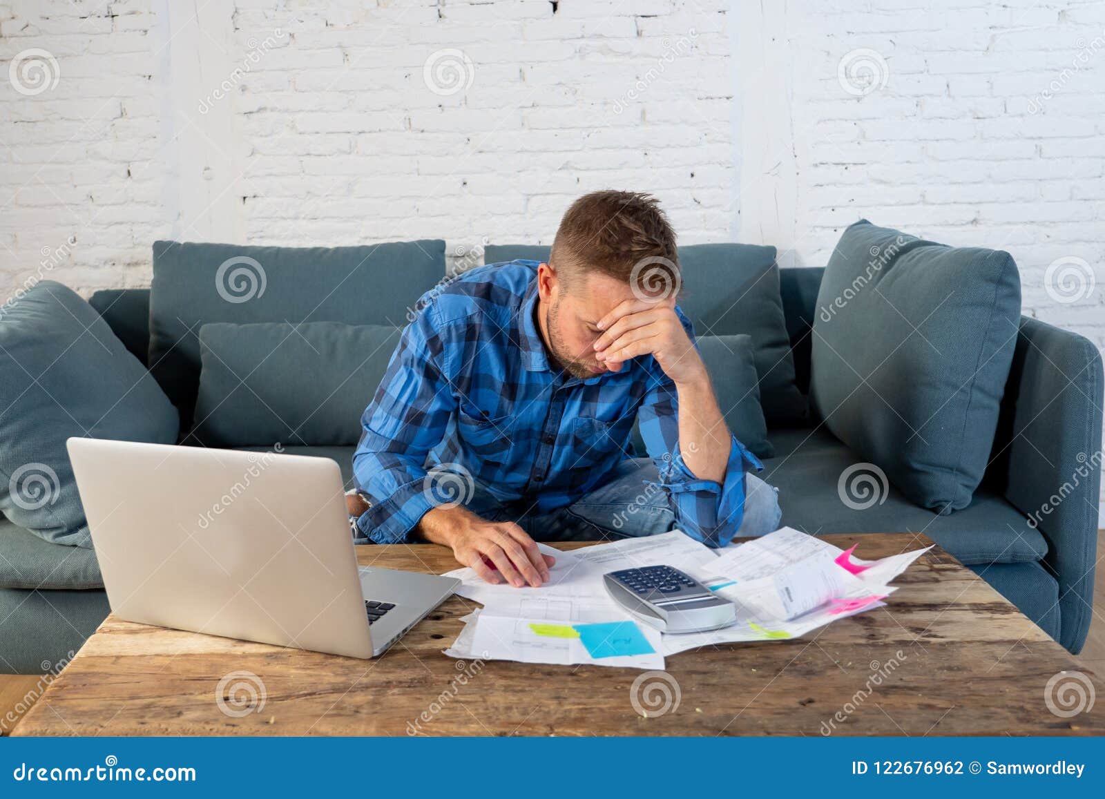 man paying bills managing finances