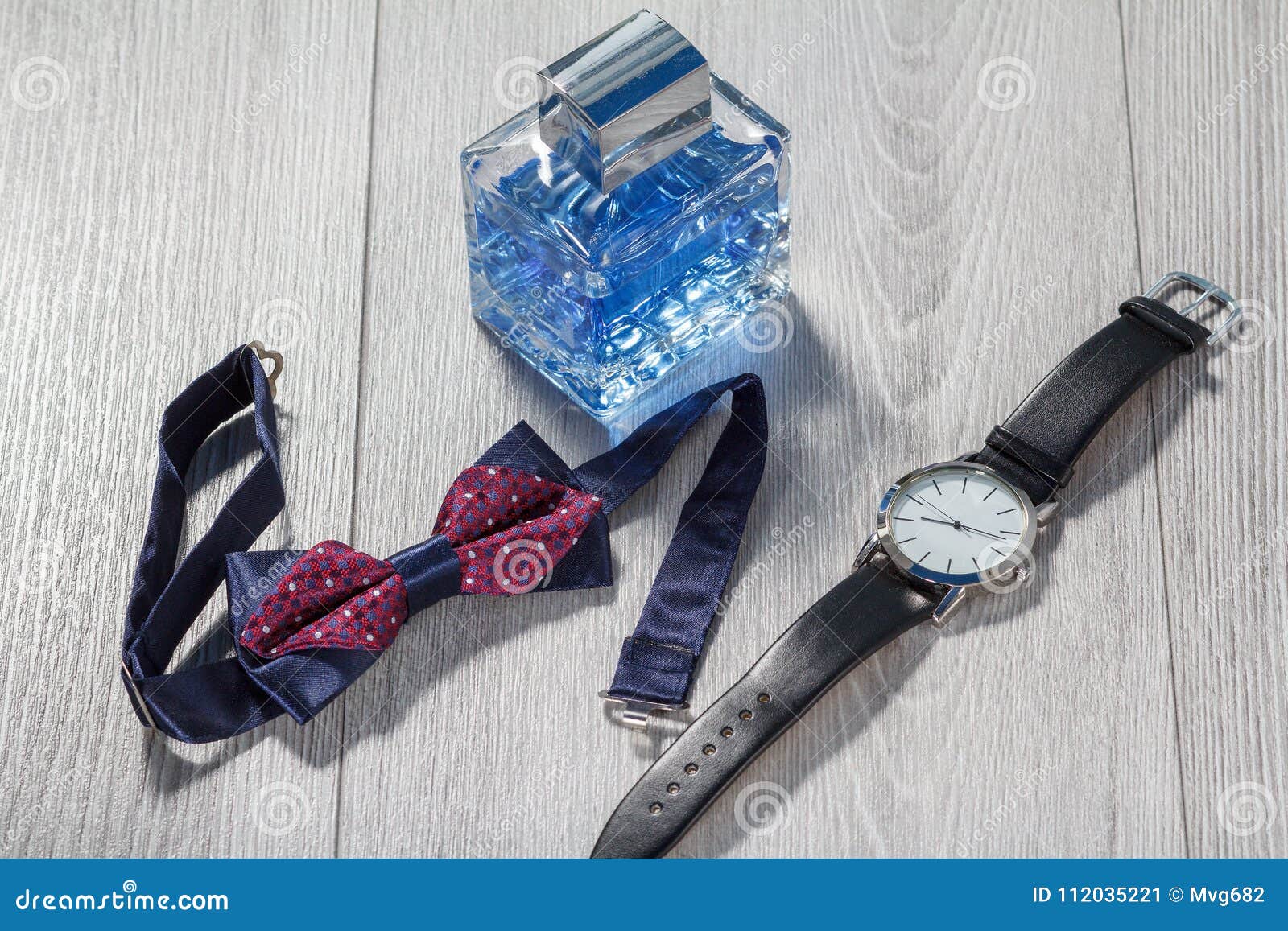 Man Perfume, Watch with a Black Leather Strap and Bow Tie Stock Image ...
