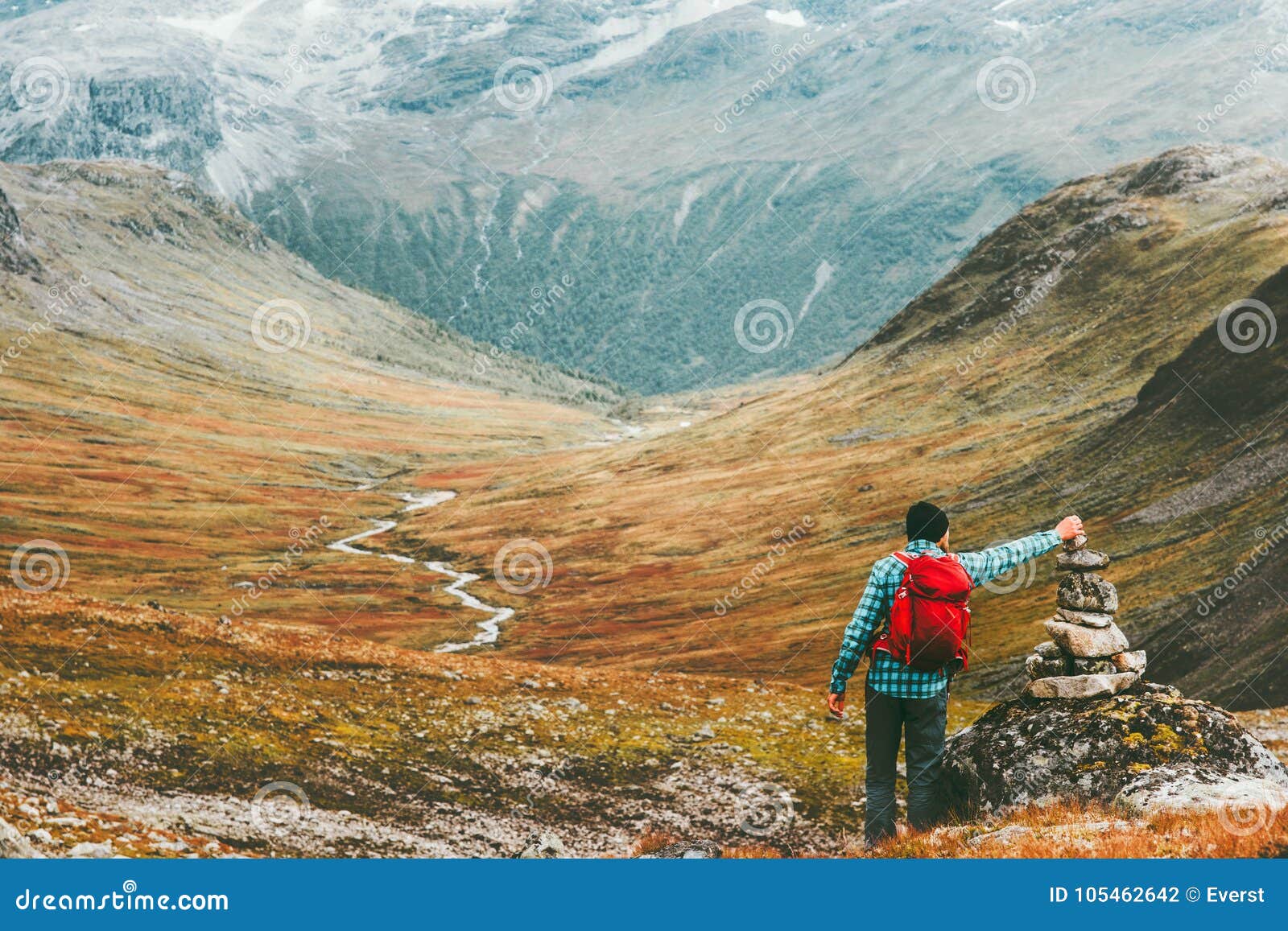 Man Placing Stone To Rock Cairn Marking Route Stock Photo - Image of ...