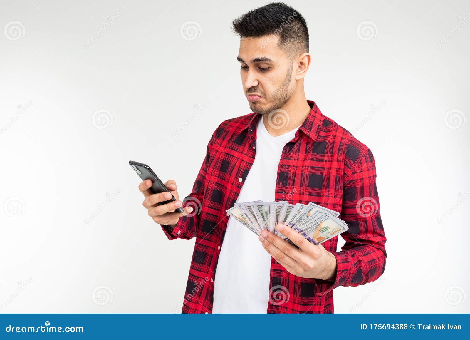 A Man in a Plaid Shirt Reports Winning Money in a Casino on a White ...