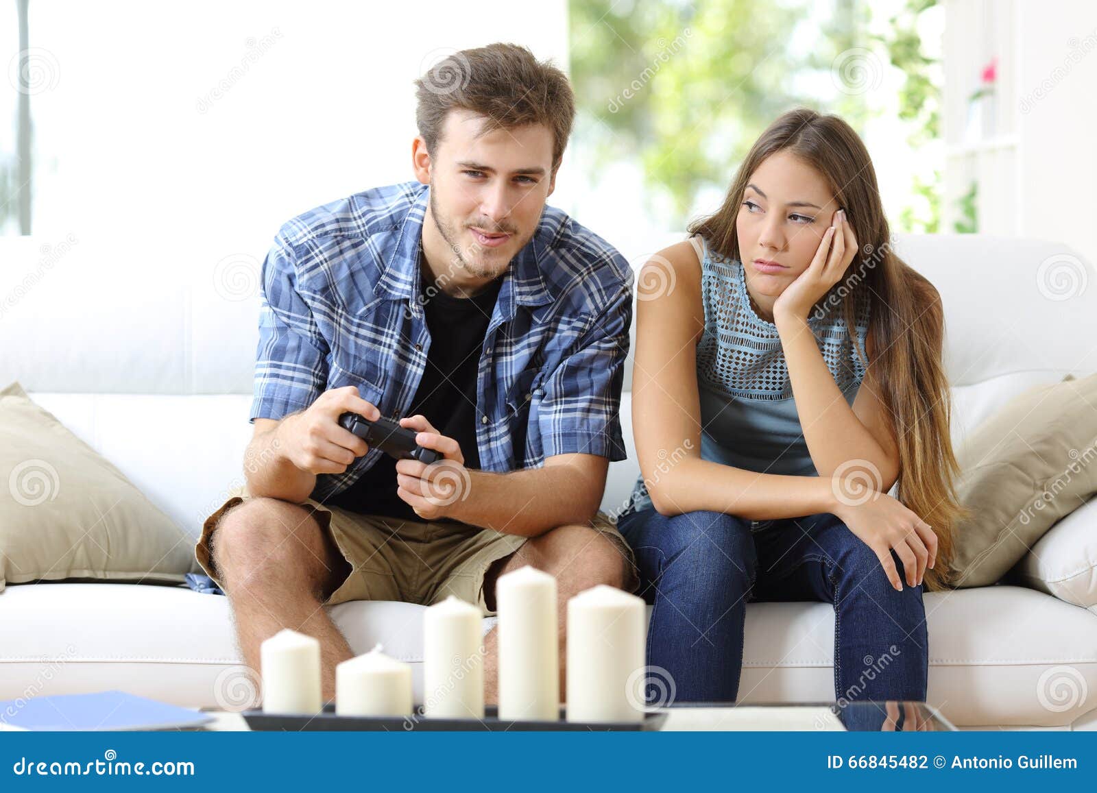 man-playing-video-games-girlfriend-bored