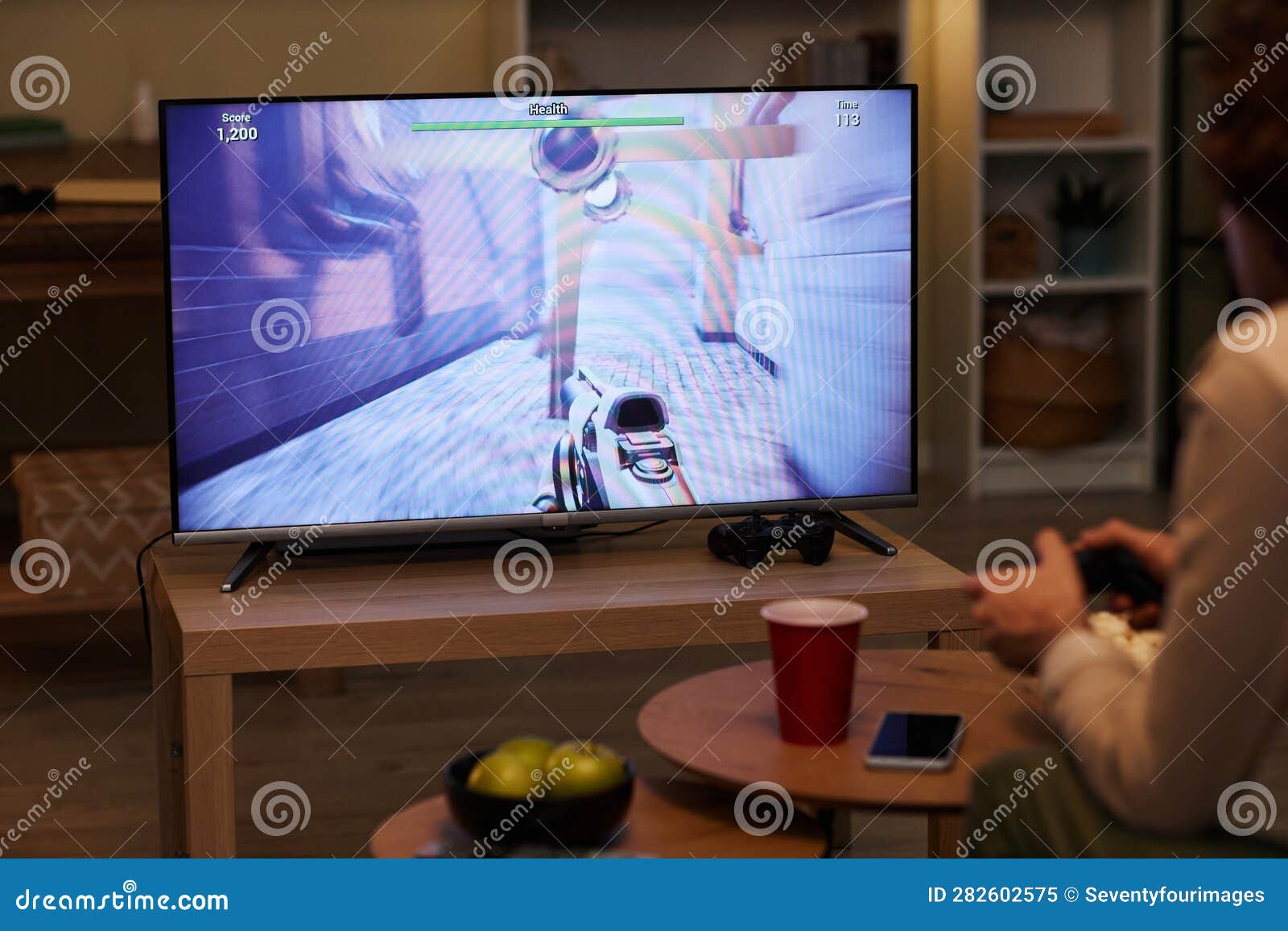 Man Playing Videogames on TV with Game Screen Stock Image Image of