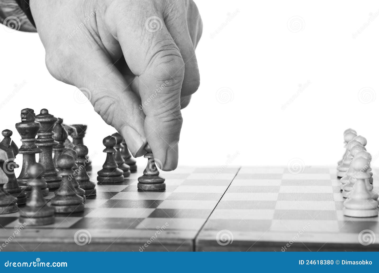 Hand Of A Man Taking A Chess Piece To Make The Next Move In A Chess Game.  Close Up. Spring Day Outside. Stock Photo, Picture and Royalty Free Image.  Image 198493516.