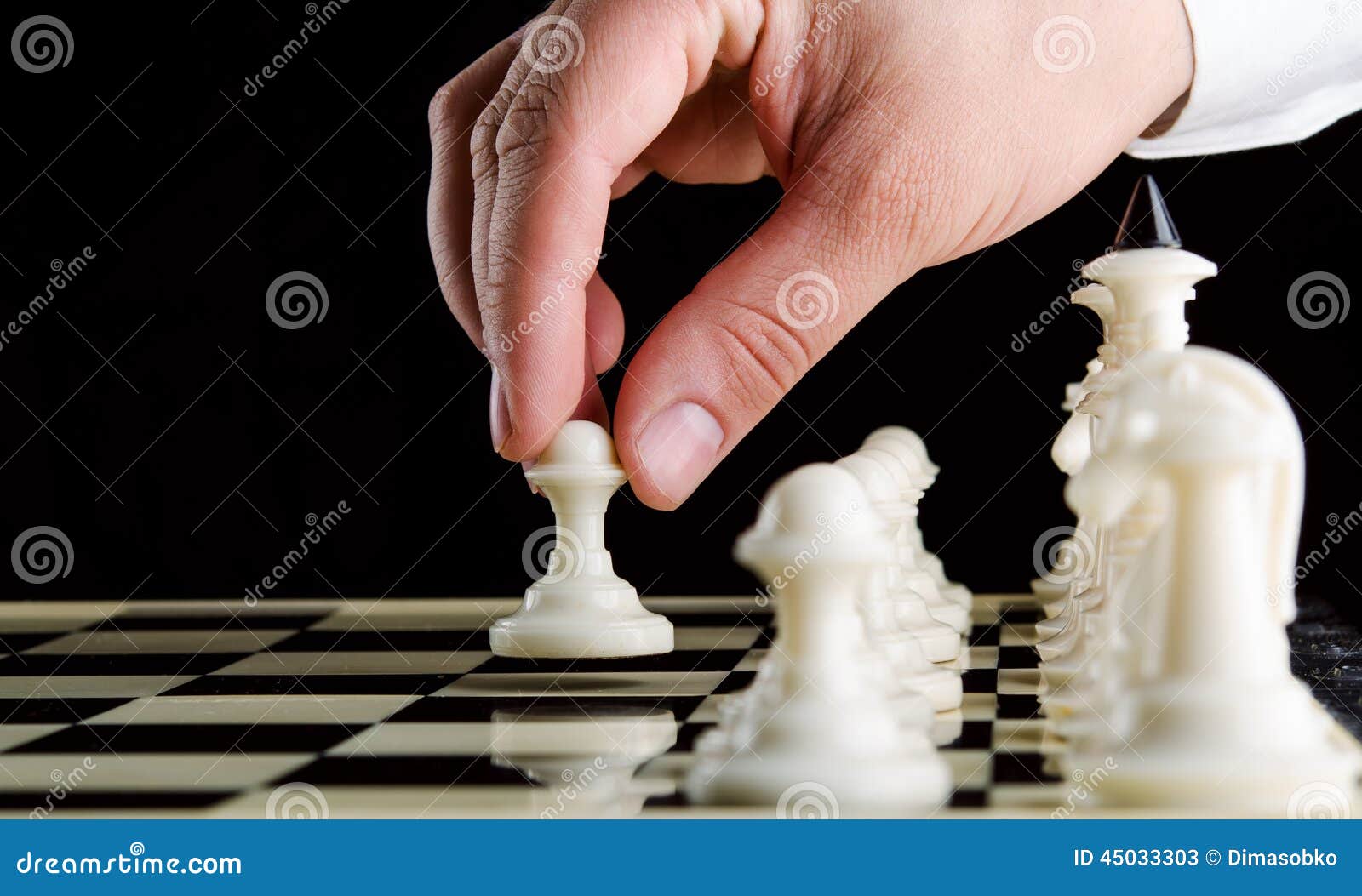 Hand Of A Man Taking A Chess Piece To Make The Next Move In A Chess Game.  Close Up. Spring Day Outside. Stock Photo, Picture and Royalty Free Image.  Image 198493640.