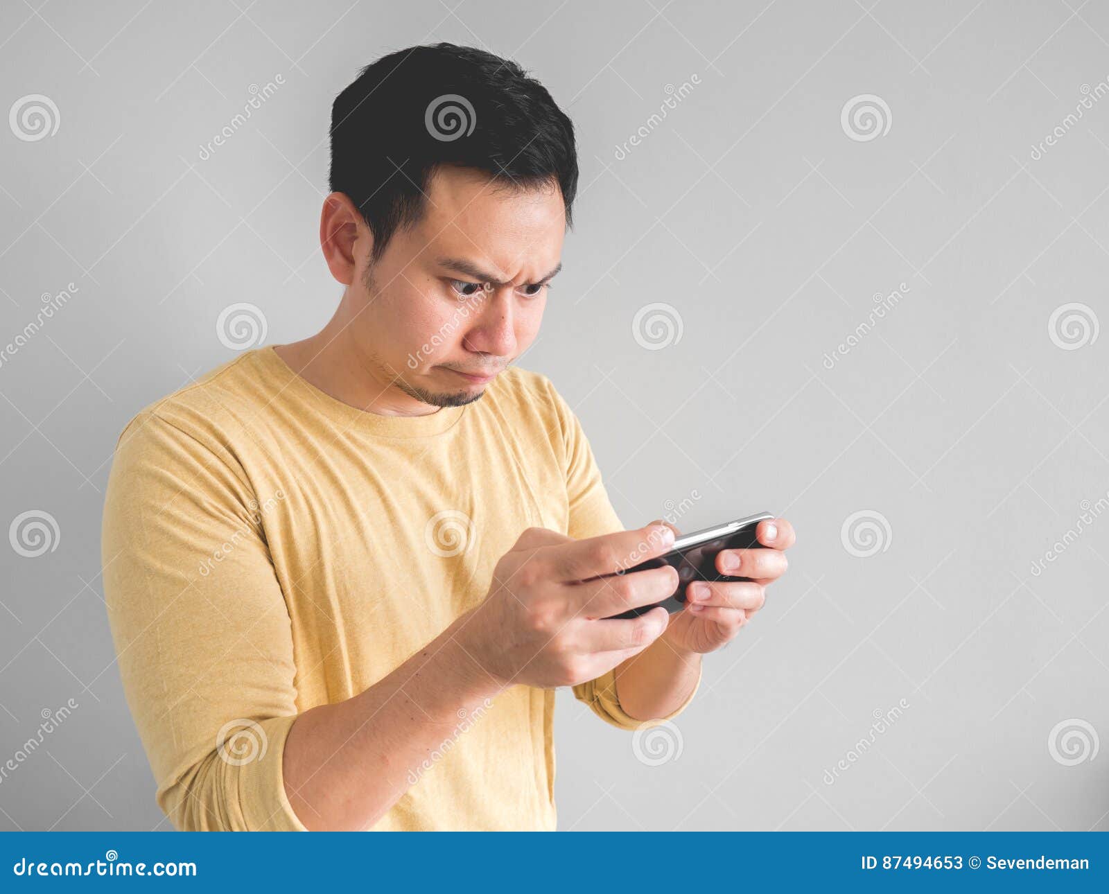 Man plays game seriously. stock image. Image of chat - 86505147