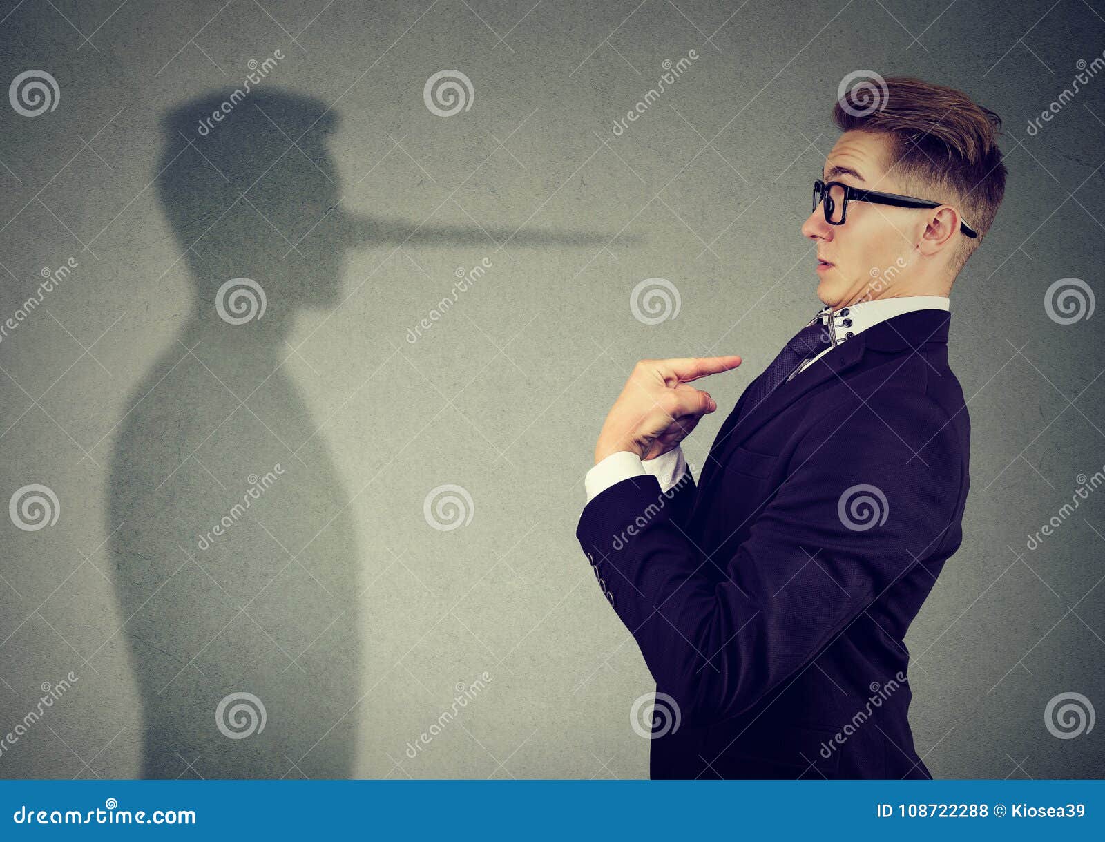 man pointing at himself while lying