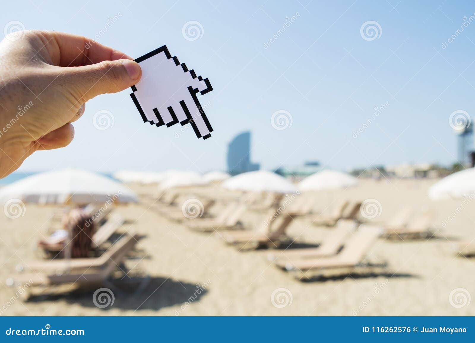 man pointing to la barceloneta beach in barcelona