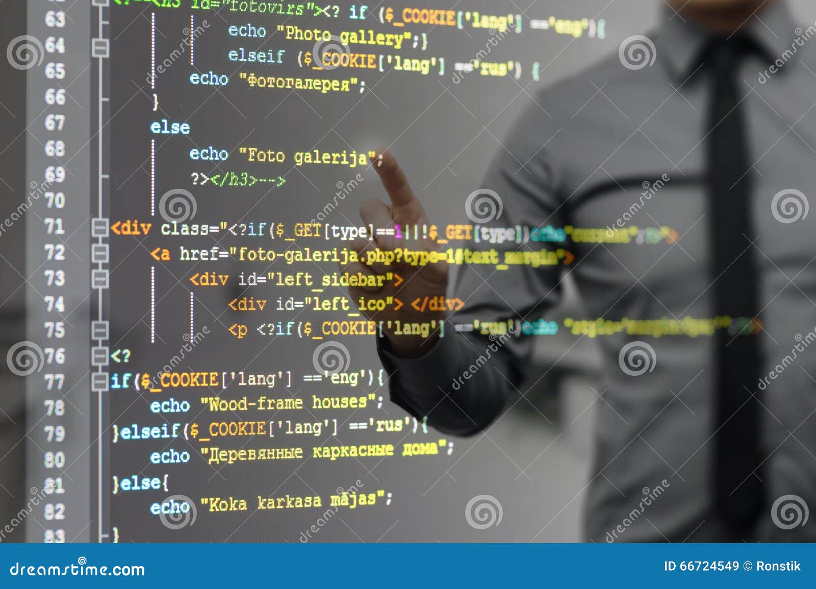 man pointing on virtual screen with website programming code