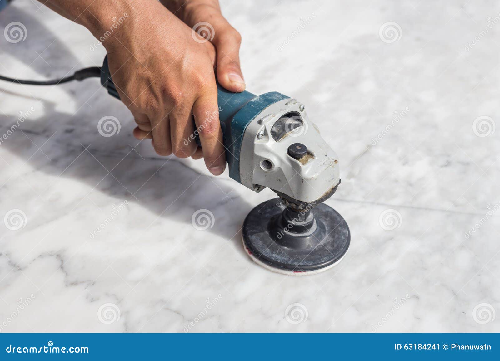 man polishing marble table by angle grinder