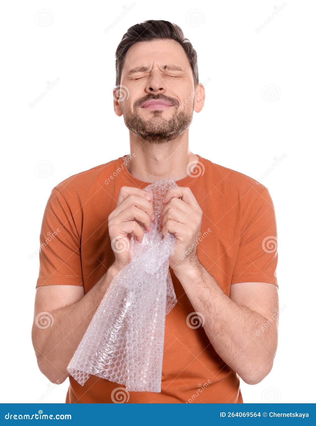 Man Popping Bubble Wrap on White Background. Stress Relief Stock Photo