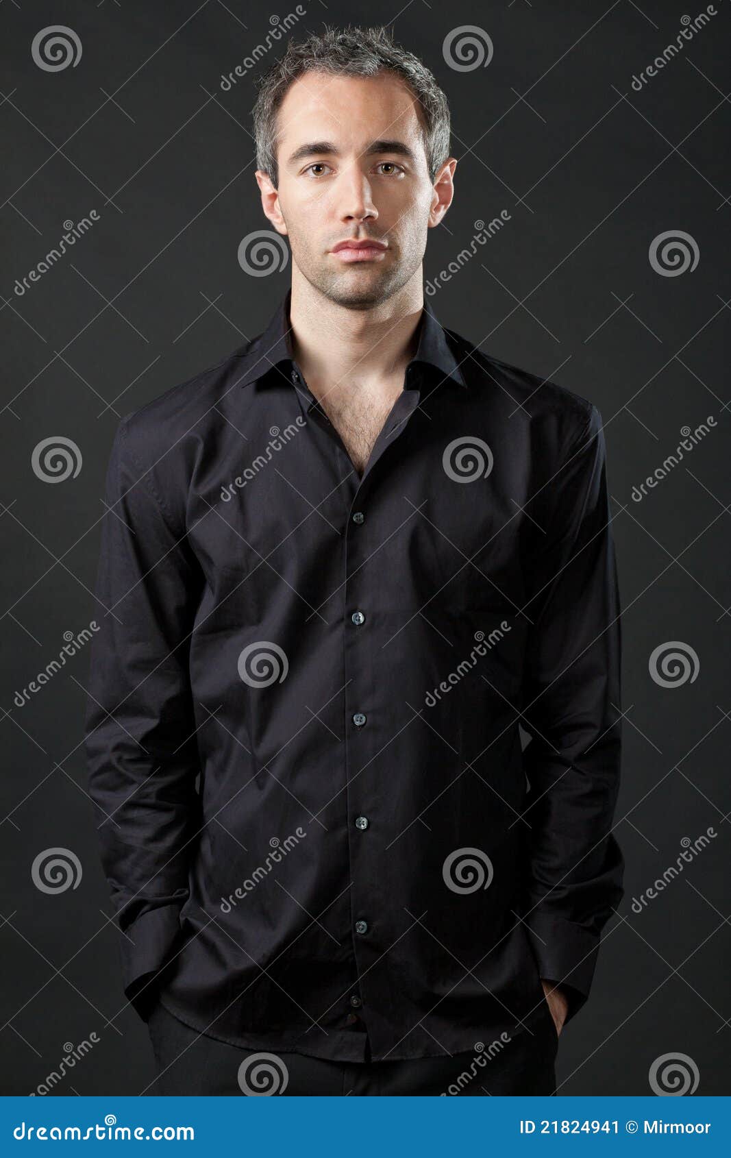 Man Posing in Black Shirt on Dark Background. Stock Image - Image of ...
