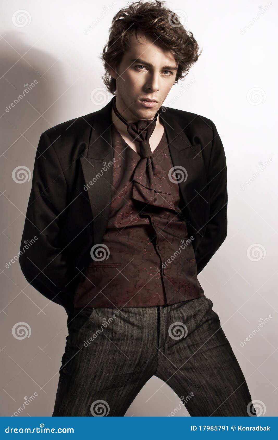 man posing in elegant clothes