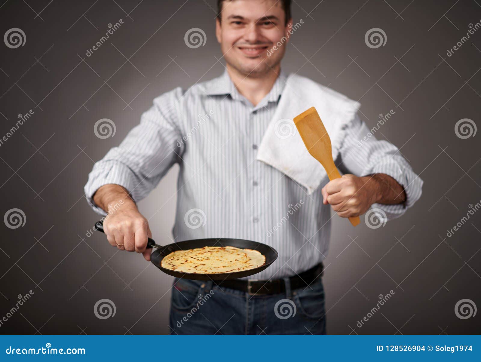 Man Posing with a Pancake in a Pan, White Shirt and Pants, Gray