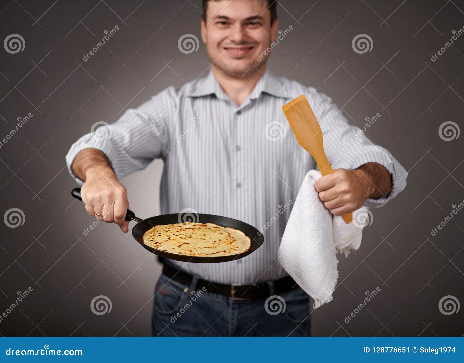 Man Posing with a Pancake in a Pan, White Shirt and Pants, Gray