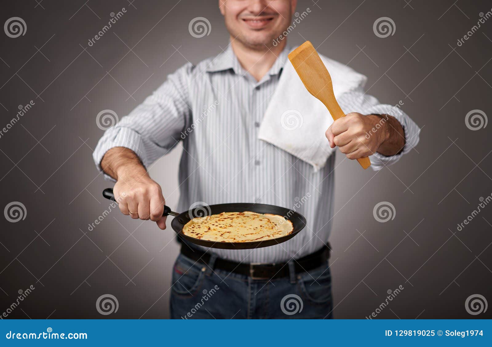 Man Posing with a Pancake in a Pan, White Shirt and Pants, Gray