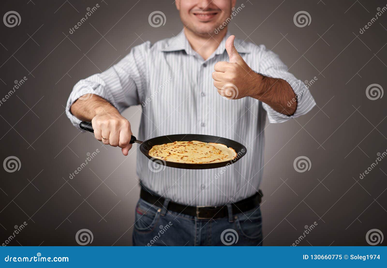 Man Posing with a Pancake in a Pan, White Shirt and Pants, Gray