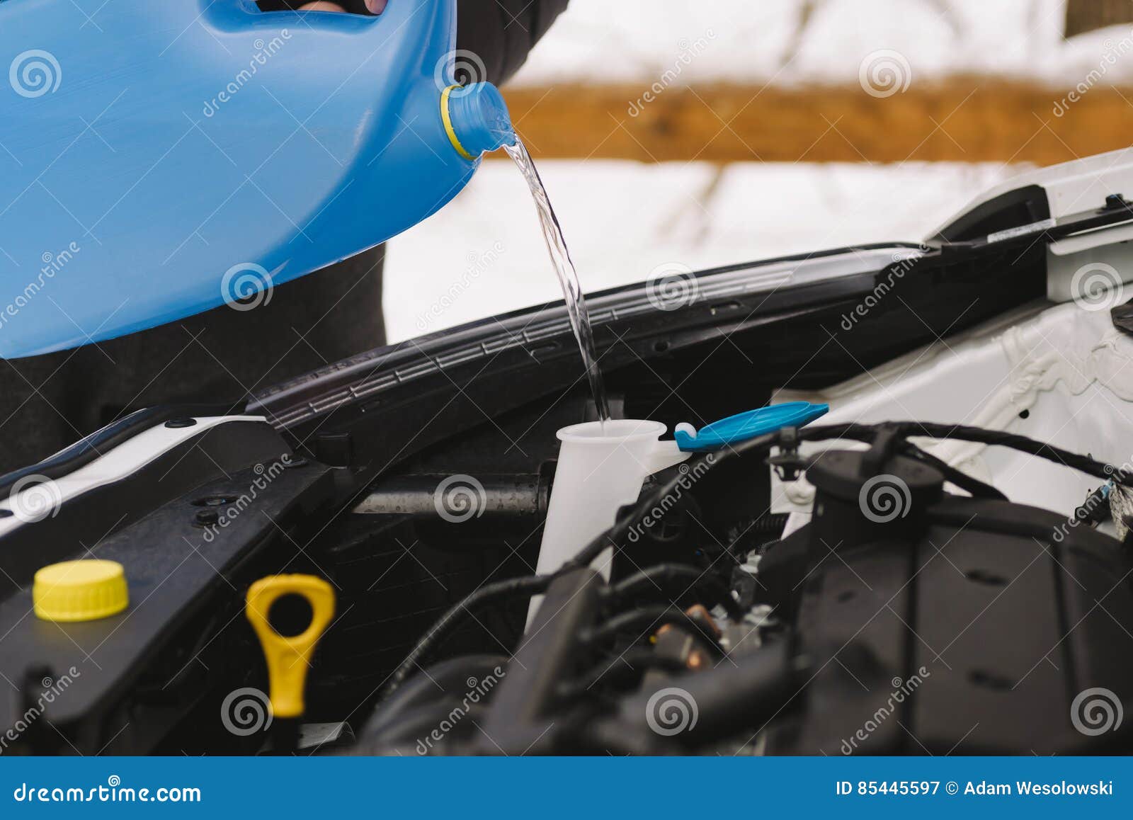 Man Pouring Liquid from Plastic Canister into Car Washer Fluid Reservoir, C  Stock Image - Image of canister, motor: 154937505