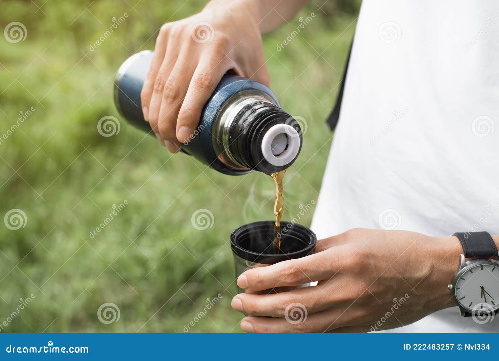 Close-up of Man Holding Thermos and an Iron Mug, Pouring Hot Tea Outdoors.  Selective Focus on Thermo Flask Stock Photo - Image of beverage, iron:  231468226