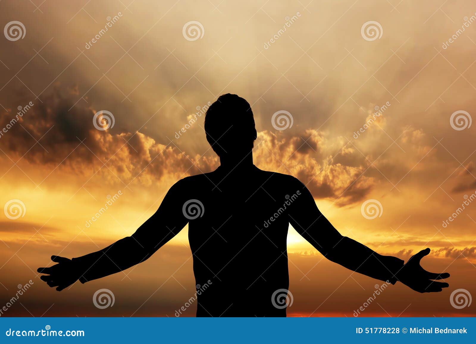 man praying, meditating in harmony and peace at sunset