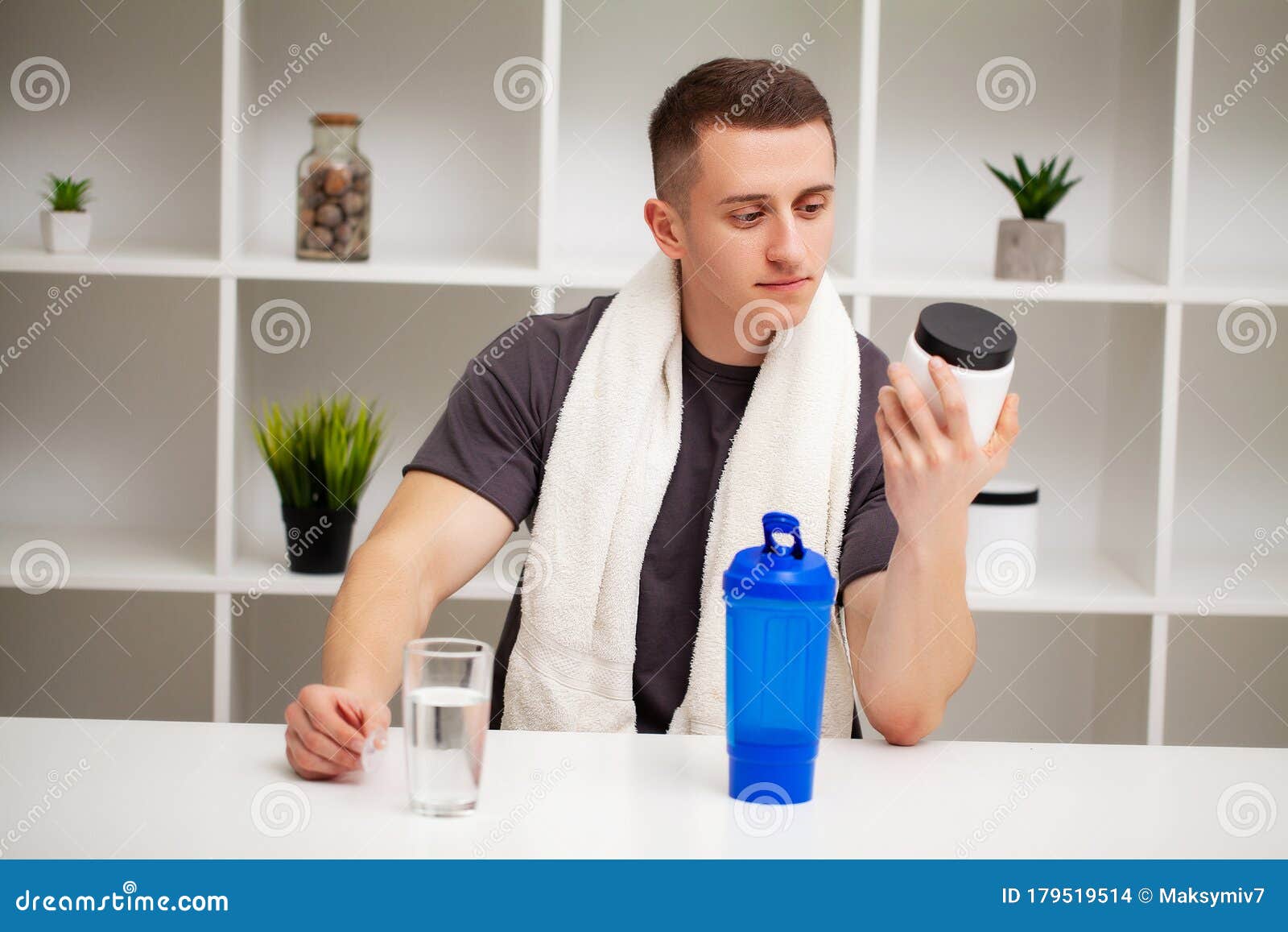 Man Prepares a Protein Shake in the Shaker after Training Stock Photo
