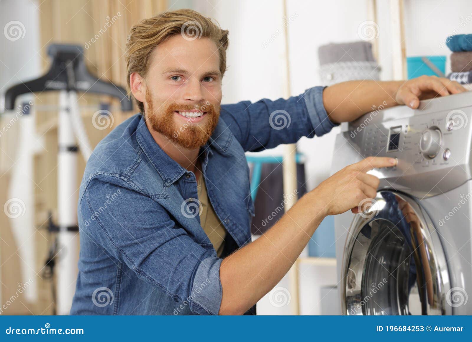 Man Pressing Button To Start Washing Machine Stock Image Image of