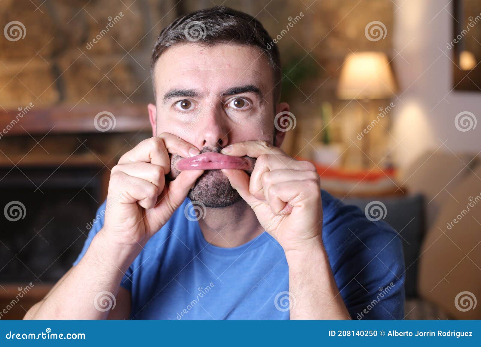 Man Pressing Lips with Fingers Stock Photo Image of blow, facial 208140250