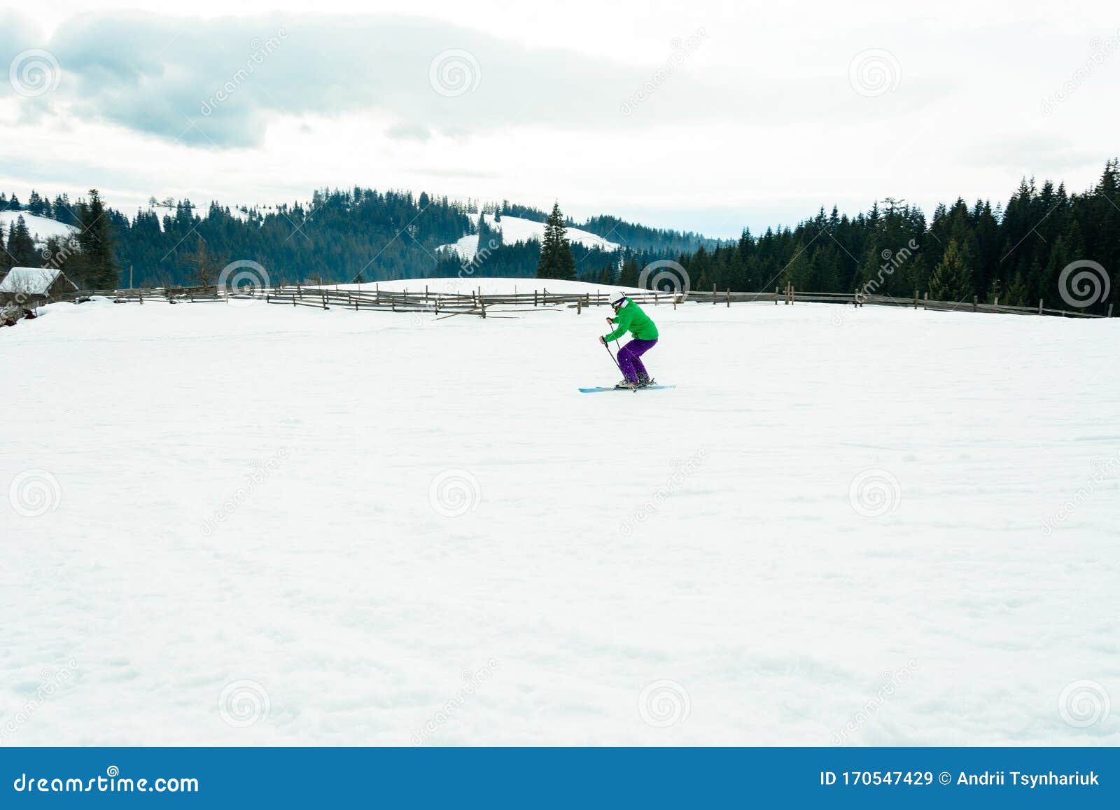 A Man in a Professional Outfit Rushes from the Mountain Skiing in the ...