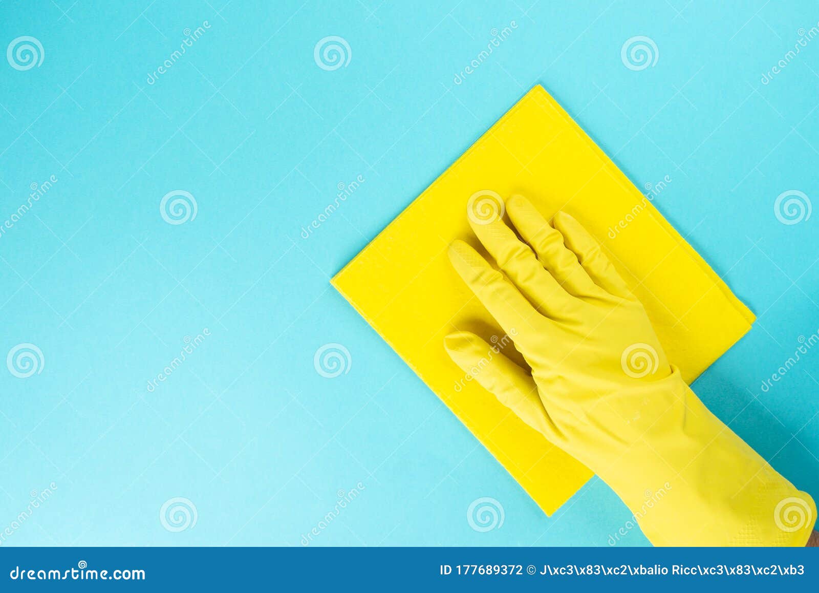 Man with Protective Rubber Glove with Microfiber Cloth for Cleaning