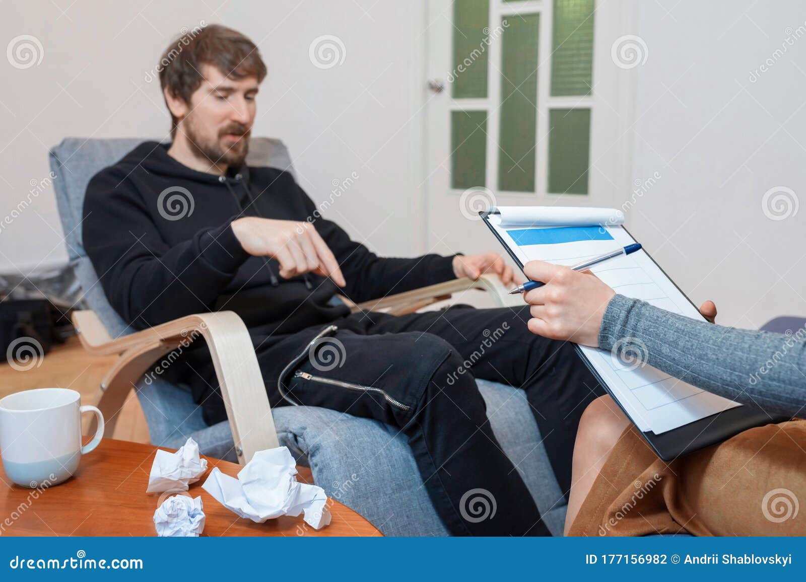 a man in a psychologists office, talks about his problems. healthcare concept