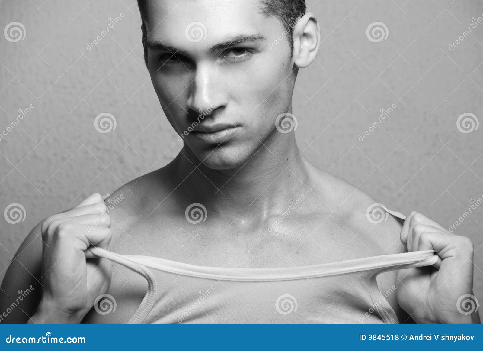 Man pulling tshirt stock photo. Image of macho, pull 9845518