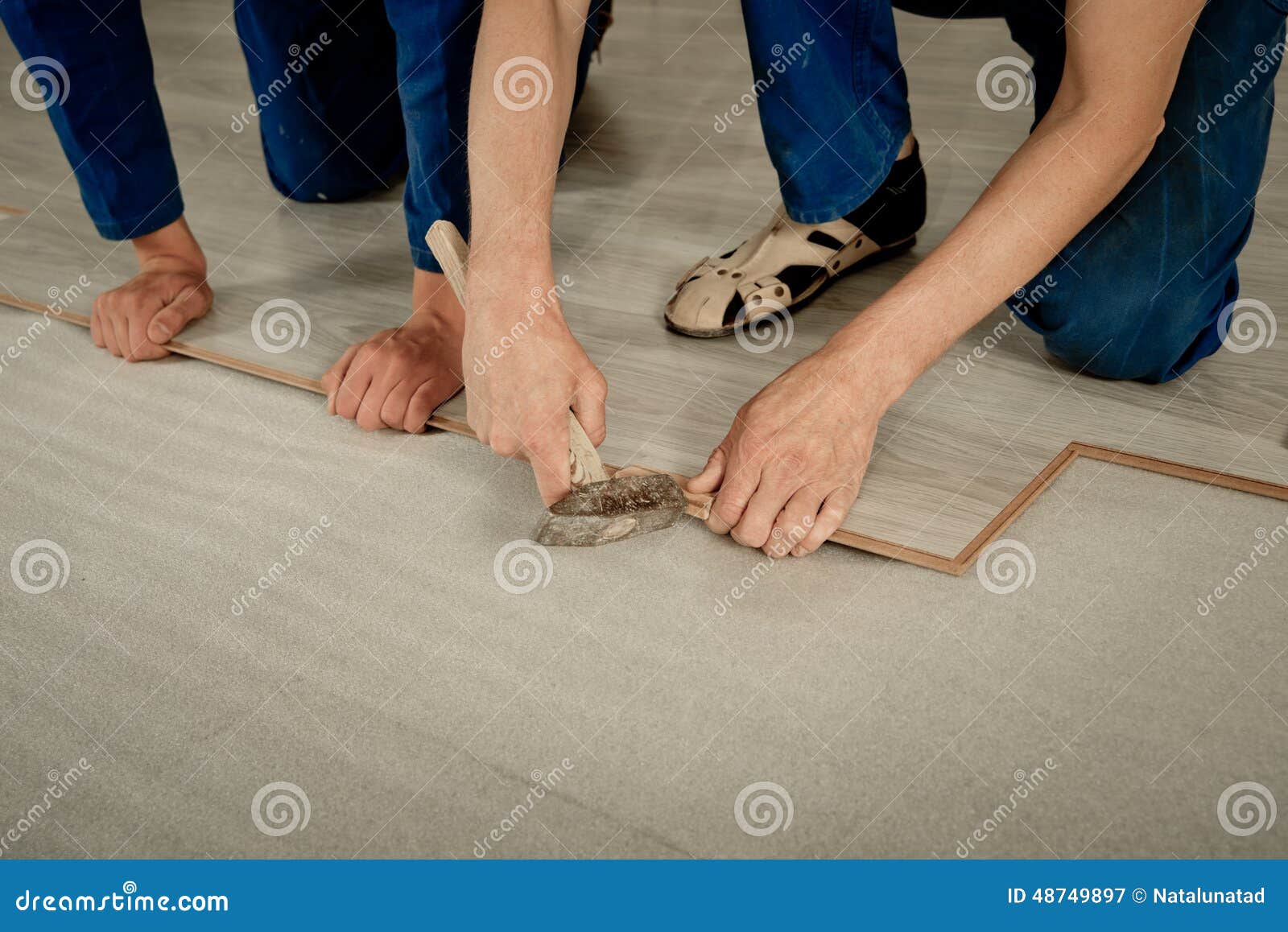 Man puts laminate stock image. Image of hand, laminate 48749897