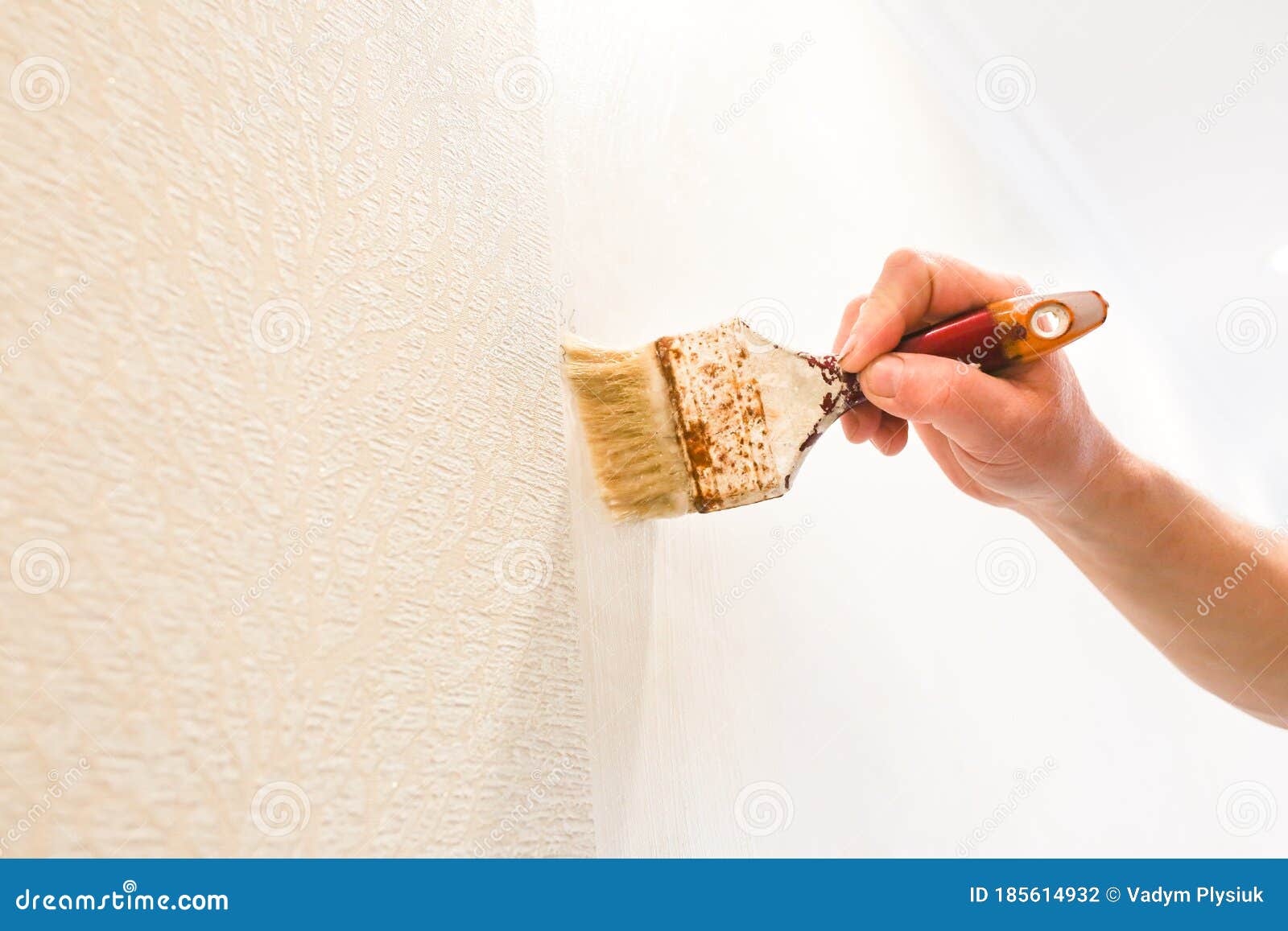 Man is Putting Glue on the Wall with Brush. Wallpaper Hanging. Maintenance  Repair Works Renovation in the Flat Stock Photo - Image of putting,  scraper: 185614932