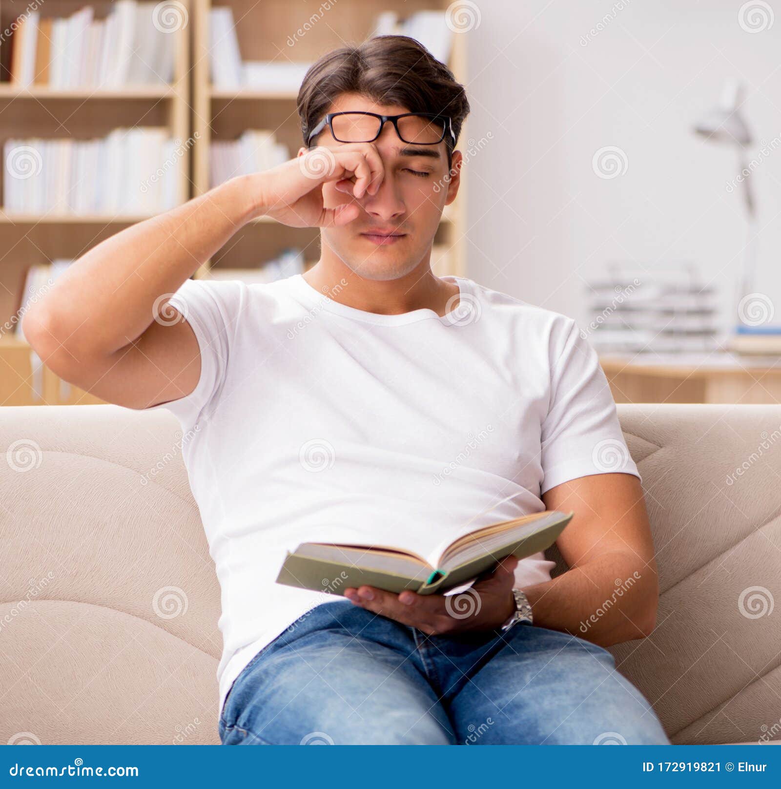Man Reading Book Sitting in Couch Sofa Stock Image - Image of literature, education: 172919821