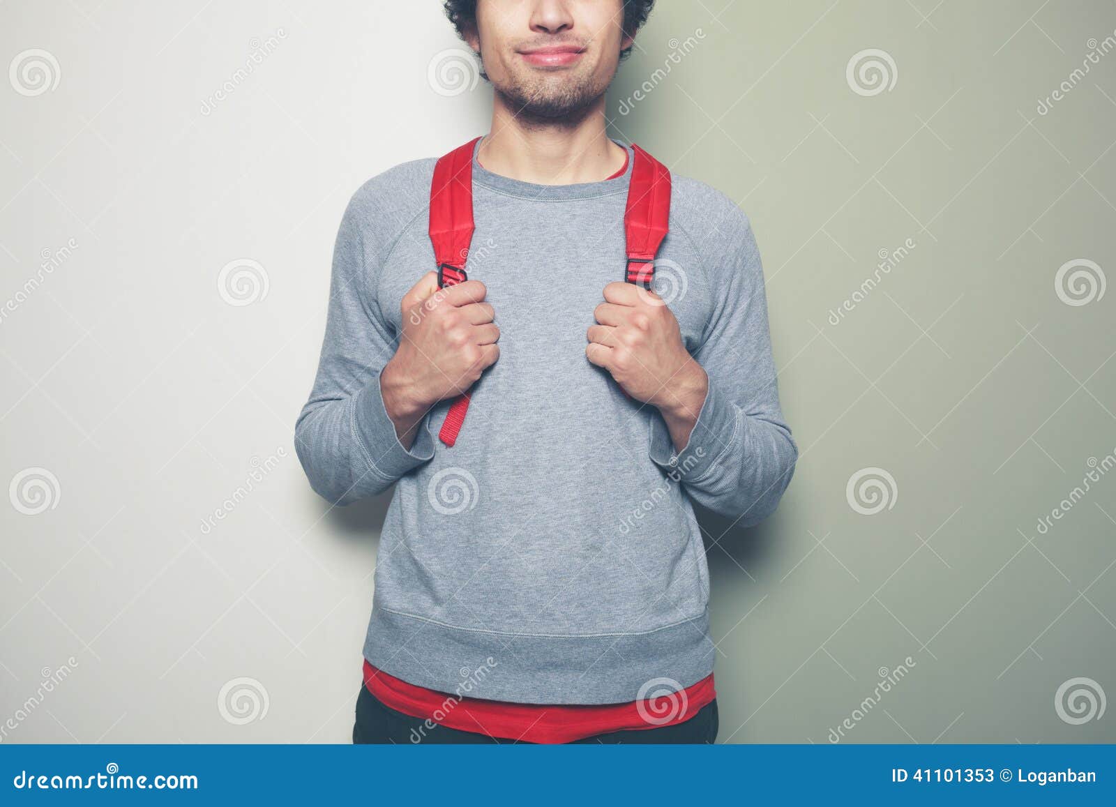 Man with Red Backpack Against Green and White Background Stock Image