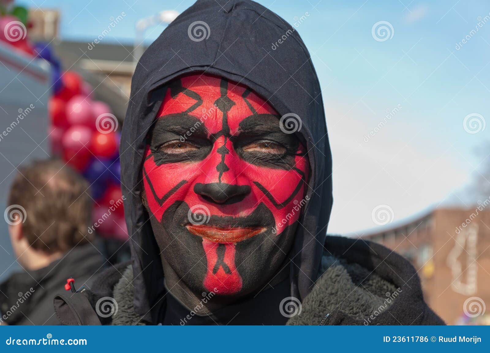 A Person with Red and Black Face Paint · Free Stock Photo