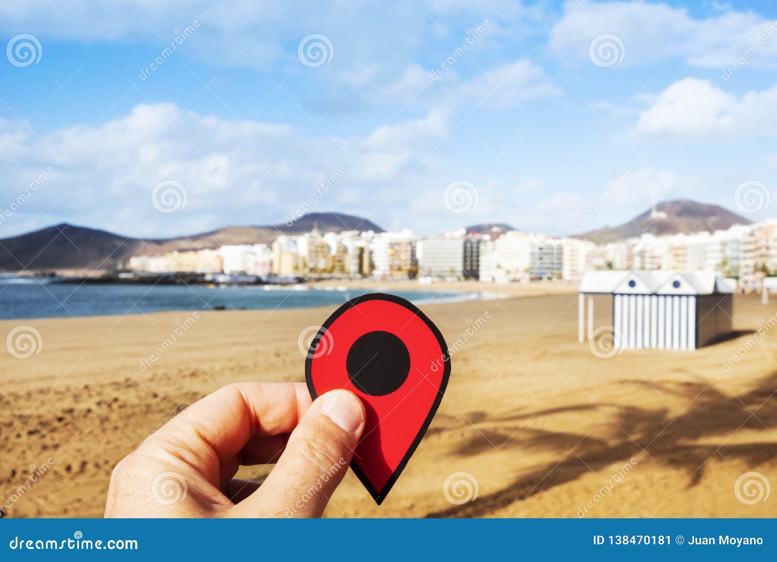 man with a red marker at playa del ingles, spain