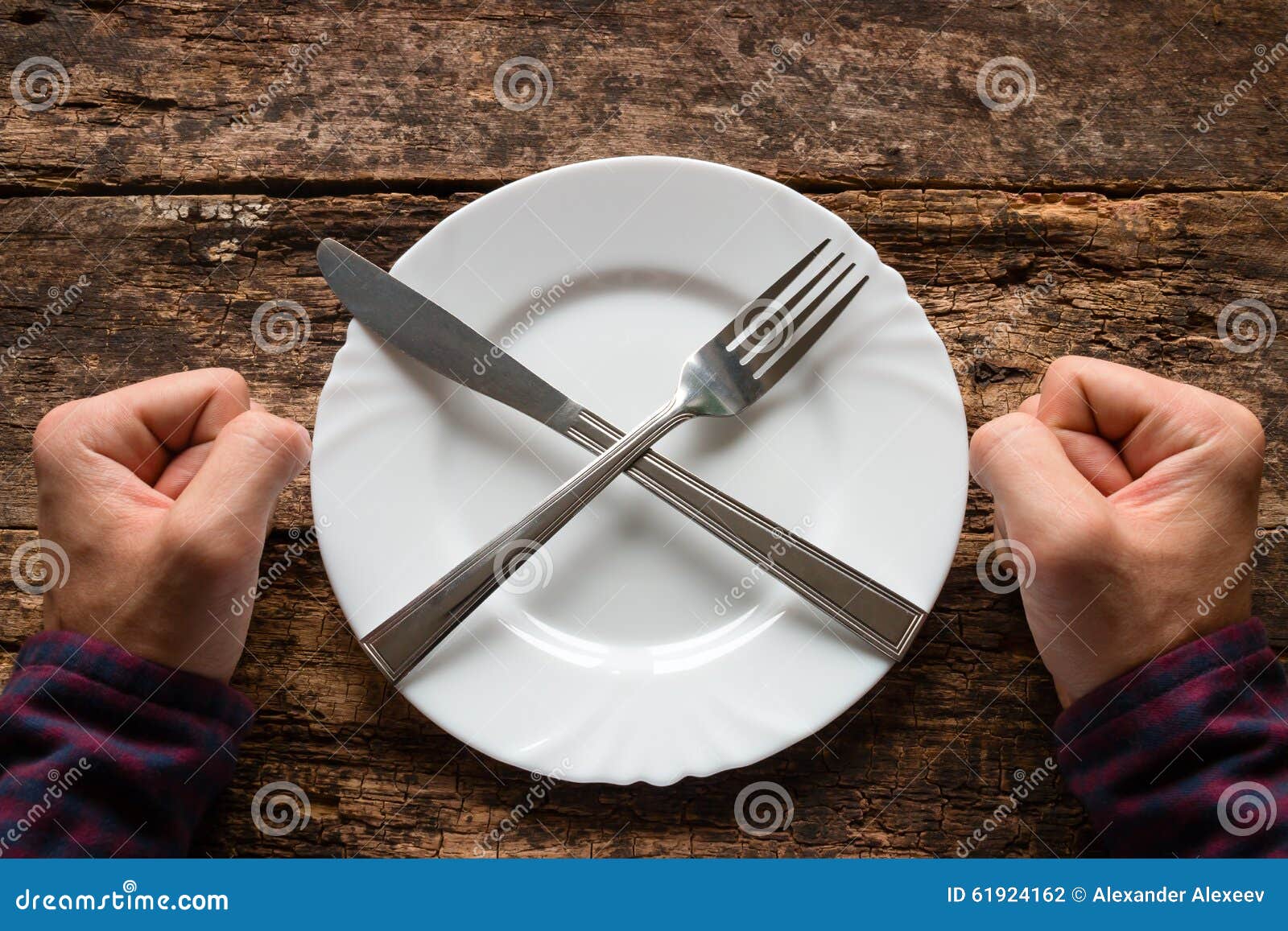Man Refuses To Eat Spoon and Fork on a Plate Stacked in the Shape of a