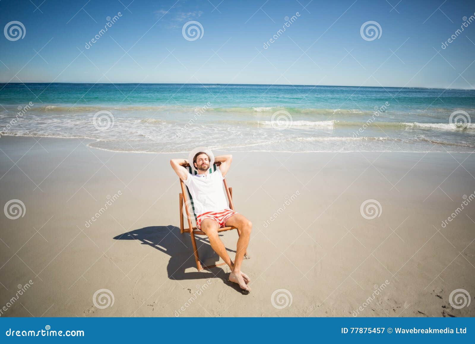 Man relaxing on armchair stock image. Image of adult 77875457