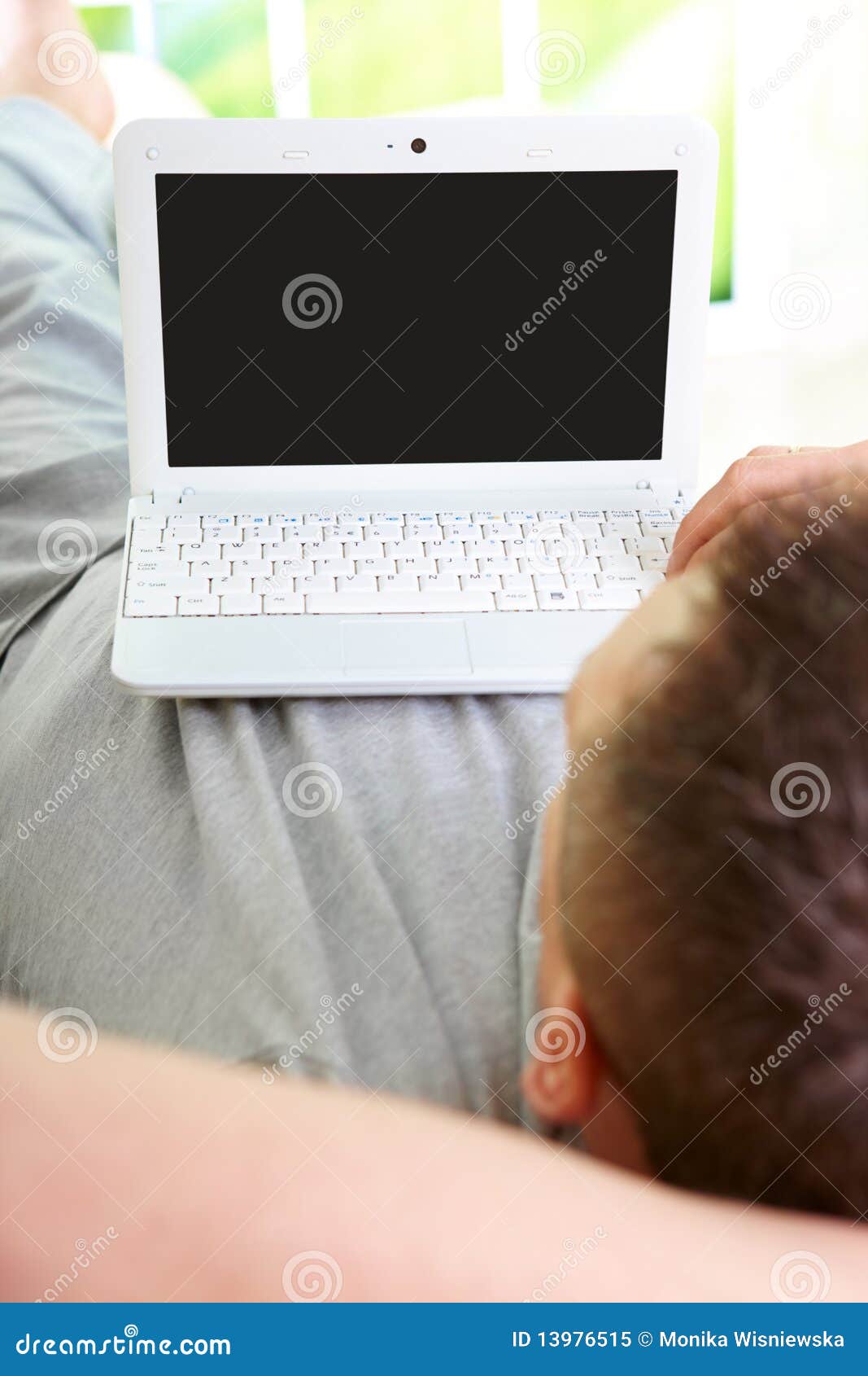Man relaxing with laptop stock image. Image of male, alone 13976515